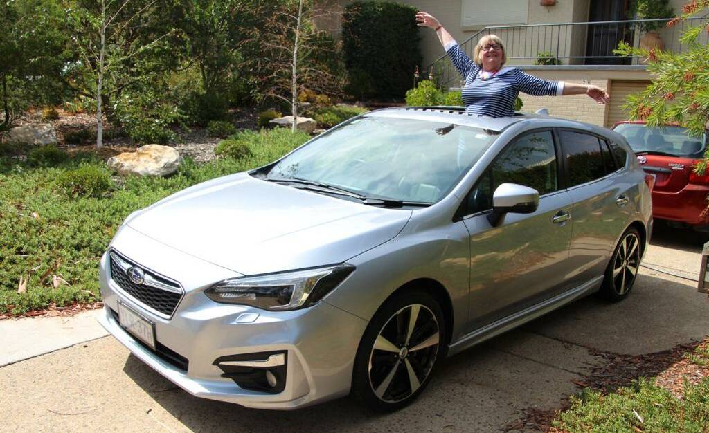 Frances Summers with the car she bought on Monday morning before the hail. Picture: Supplied