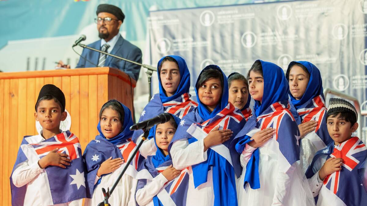 Children sing the Australian national anthem at a ceremony to mark the laying of a foundation stone at a new mosque in Narrabundah. Picture: Sitthixay Ditthavong