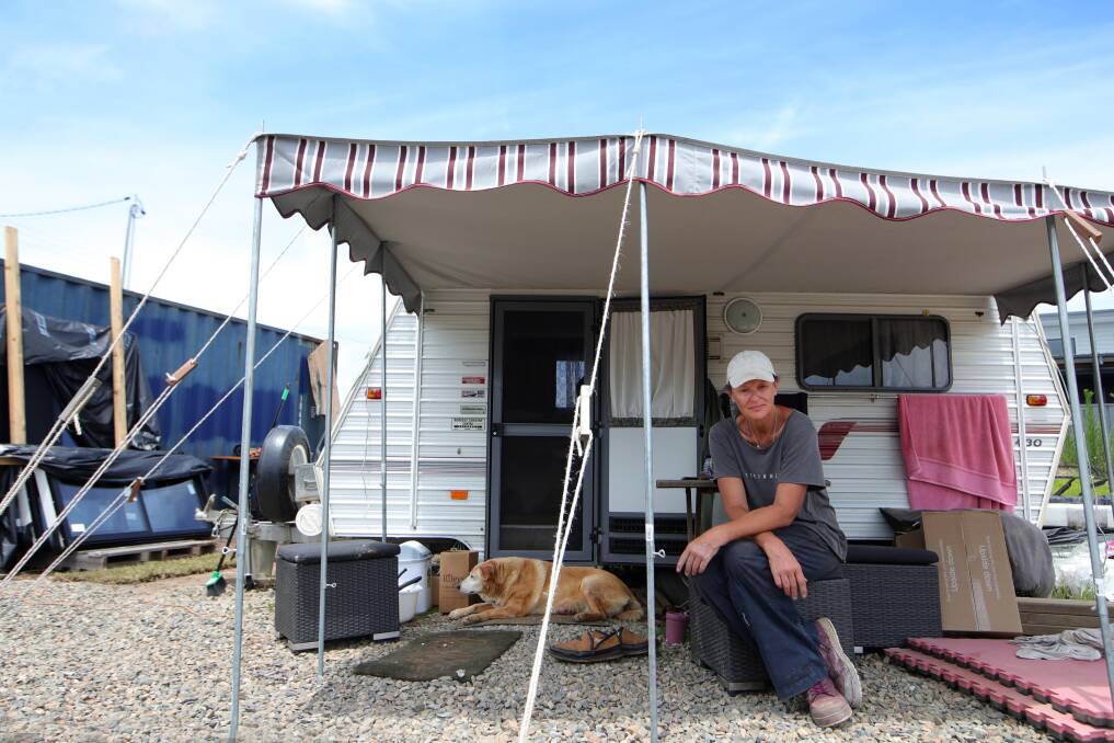 Christine Webb and her husband Adam live in their caravan at Conjola Park as they slowly rebuild what they lost in the fire. Picture: Sylvia Liber.
