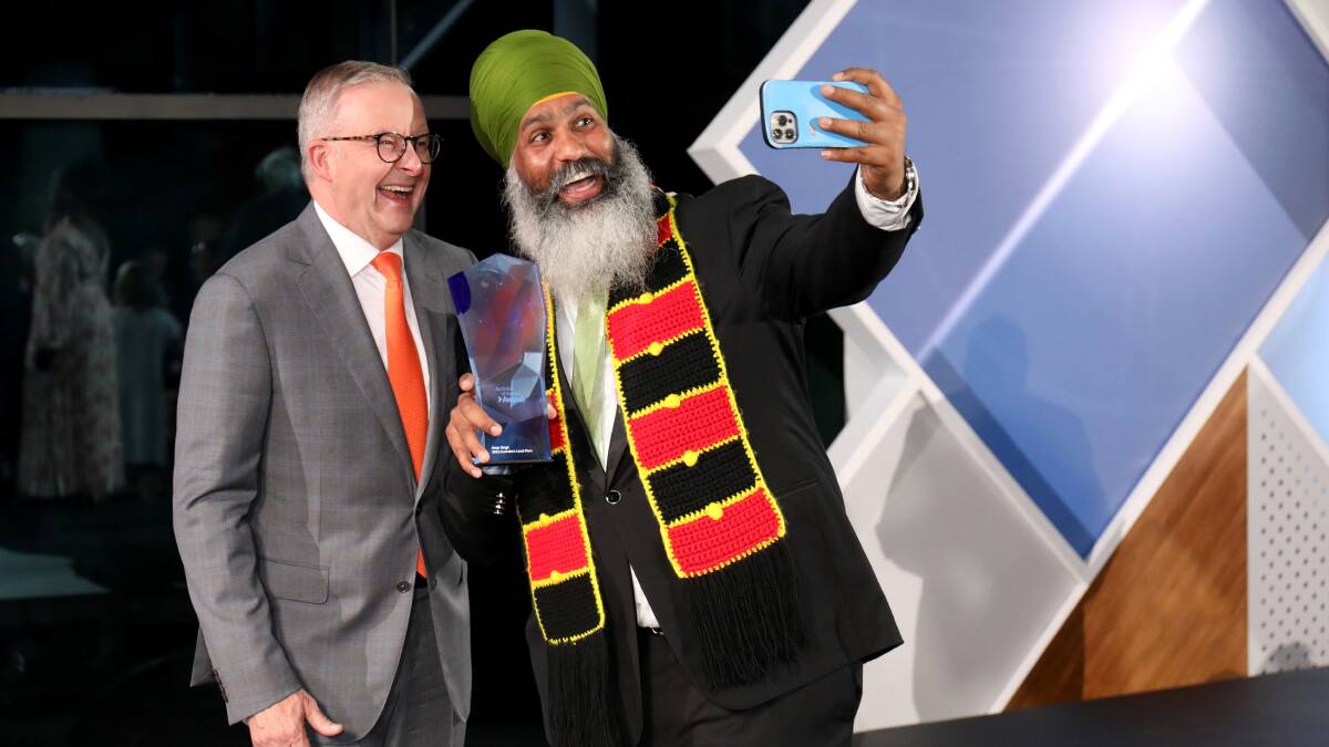 Anthony Albanese presented Amar Singh with the Local Hero of the Year award. Picture by James Croucher