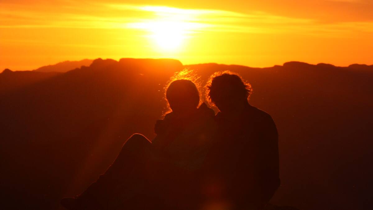 Louise and Bruce Fairfax doing what they loved - watching a sun rise on a mountain.