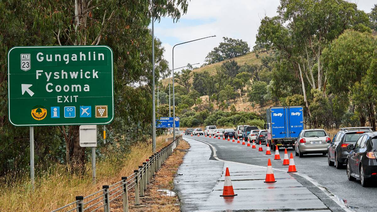 Cars line up along Federal Highway waiting to enter the ACT amid the border closure. Picture: Matt Loxton