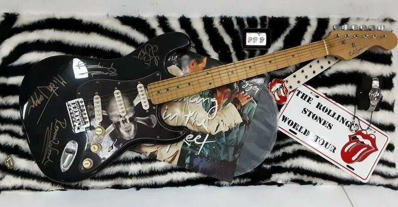 Electric guitar with Rolling Stones memorabilia, signed by Rolling Stones members (all unverified). Picture by Lloyds Auctioneers and Valuers