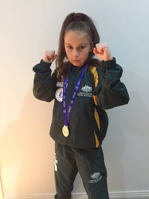 Hodgson with her silver medal from the 2016 World Muay Thai Championships in Bangkok. Photo: Muaythai Australia
