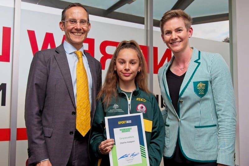 Charlia Hodgson receiving a funding grant from the Sports Commission, presented to her by Olympian Melissa Breen and Federal Minister Andrew Leigh Picture: Muaythai Australia