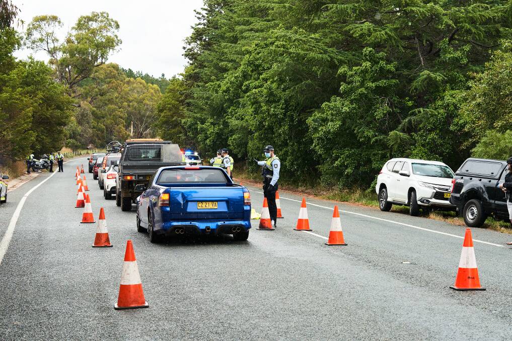 ACT Policing check cars at the NSW border on Monday. Picture: Matt Loxton 