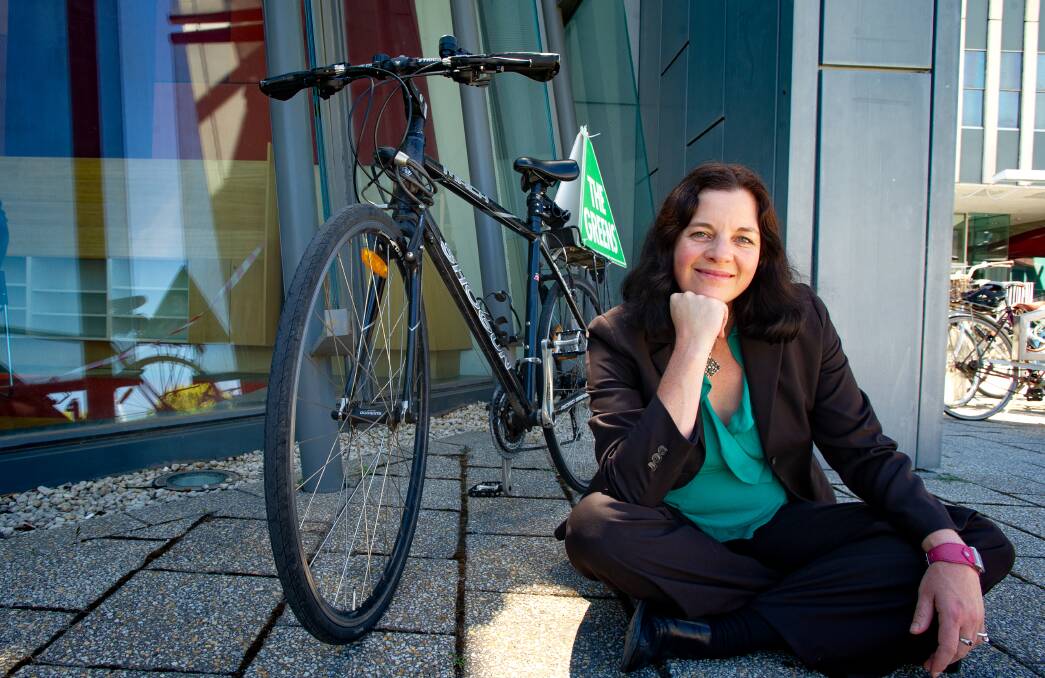 New Greens MLA Jo Clay next to the bike she rides (almost) every day to work. Picture: Elesa Kurtz