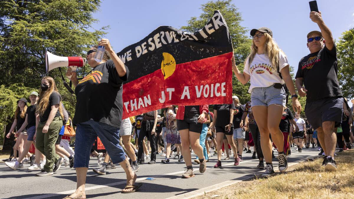 A sign with the words "We deserve better than a Voice" is carried to the Aboriginal Tent Embassy during the January 26 march. Picture by Keegan Carroll