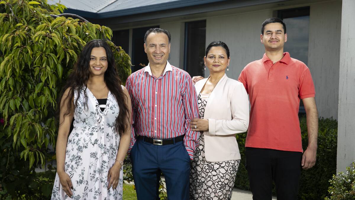 Deepak-Raj Gupta (middle left) with his wife Shuchi and children Mallika Raj and Ashvin Picture: Keegan Carroll