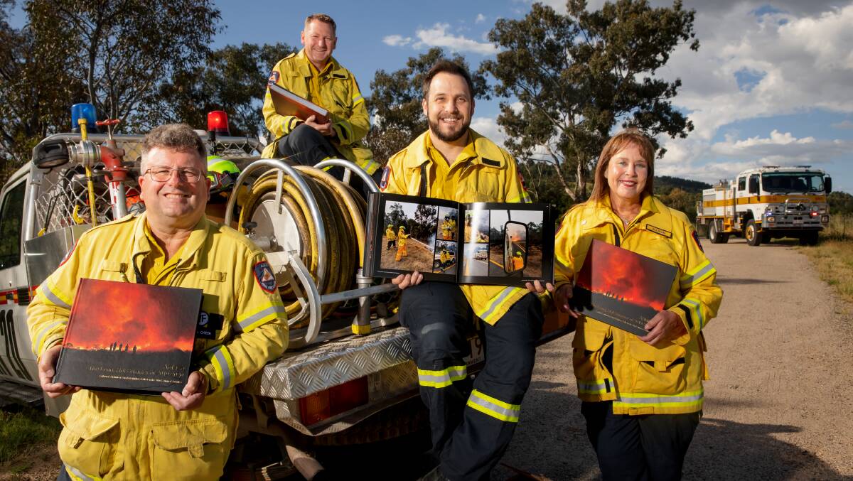 ACT Rural Fire Service volunteers, including Matt Dutkiewicz (pictured second from left), have been pushing for the compensation clause. Picture by Sitthixay Ditthavong