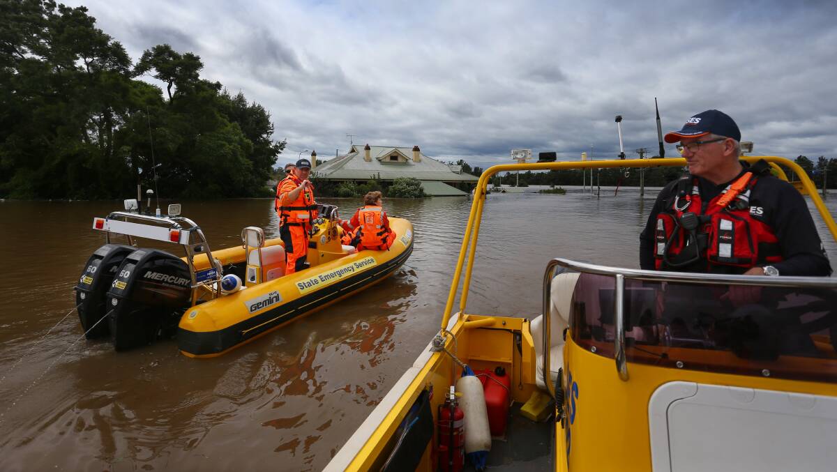 SES crews survey a flooded neighbourhood near Sydney. Extreme weather events are becoming more frequent. Picture: Getty Images