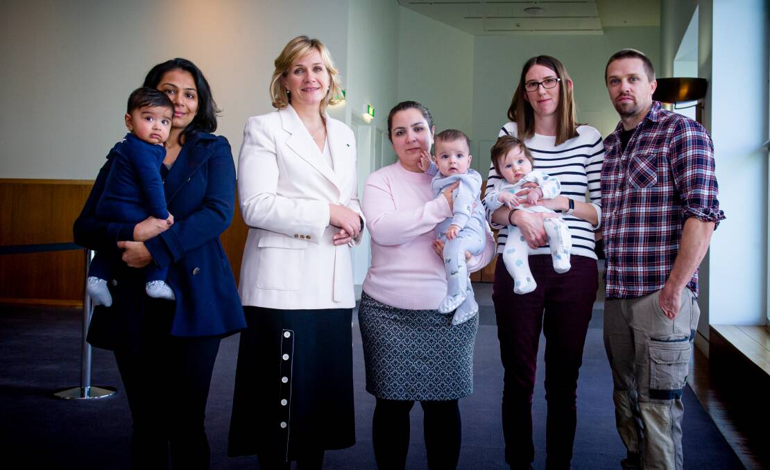 Canberra parents, Paul and Sophie Robinson with baby Lucy, Monal Vachhani with baby Aneev and Azadeh Oskouipour with her baby Xaniar Jeyhani, met with independent MP Zali Steggall in Parliament House on Tuesday. Picture: Elesa Kurtz