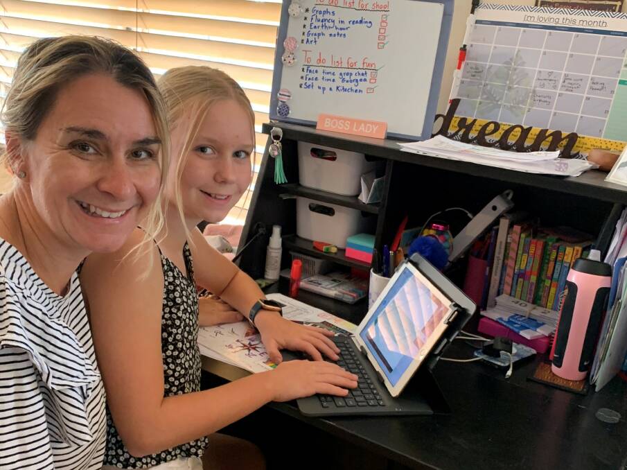 Vanessa Prail with her daughter Emma, who is among the tens of thousands of Canberra children now being home-schooled due to the coronavirus pandemic. Picture: Supplied