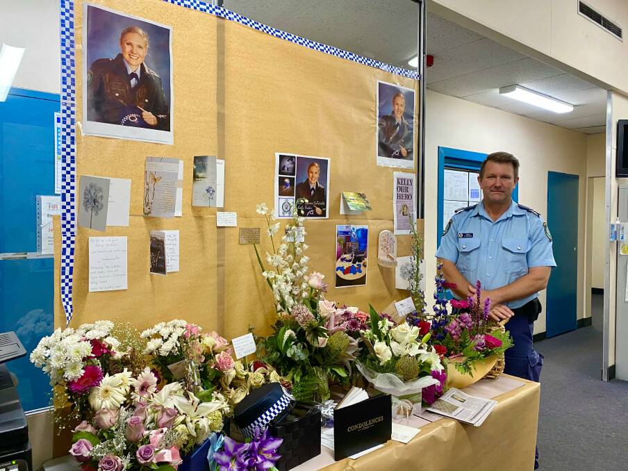 KELLY OUR HERO: Lithgow Police Sergeant Darryl Goodwin with the station's tribute for Sen Const Kelly Foster. Photo: ALANNA TOMAZIN. 