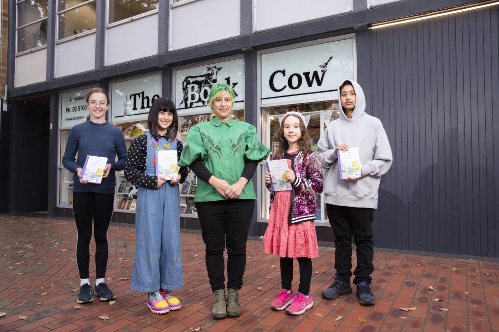 Parent and organiser of the anthology Caroline Xeri with some of the students who have work in the book: Imogen Wallace, Gaia Xeri, Ava Hope and Zen Xeri. The anthology is being launched at The Book Cow in Kingston on Saturday. Picture: Keegan Carroll