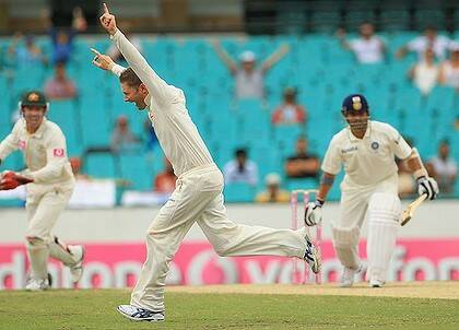 Australian skipper Michael Clarke celebrates after taking the prized wicket of Sachin Tendulkar at the SCG yesterday.