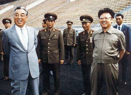 Kim Il-sung, left, and son Kim Jong-il inspect a Pyongyang stadium in 1992.