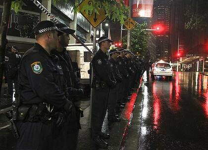 In full force ... NSW police outside the building on Clarence Street.
