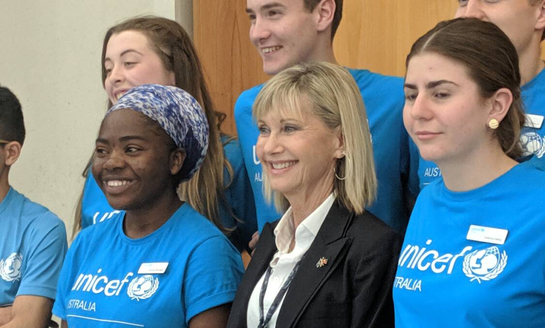 Olivia Newton-John posing with Unicef volunteers at Parliament House in 2020. Picture: Megan Doherty