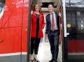 Federal Infrastructure Minister Catherine King, left, with ACT Transport Minister Chris Steel aboard a light rail vehicle at the Mitchell depot on Tuesday. Picture: James Croucher