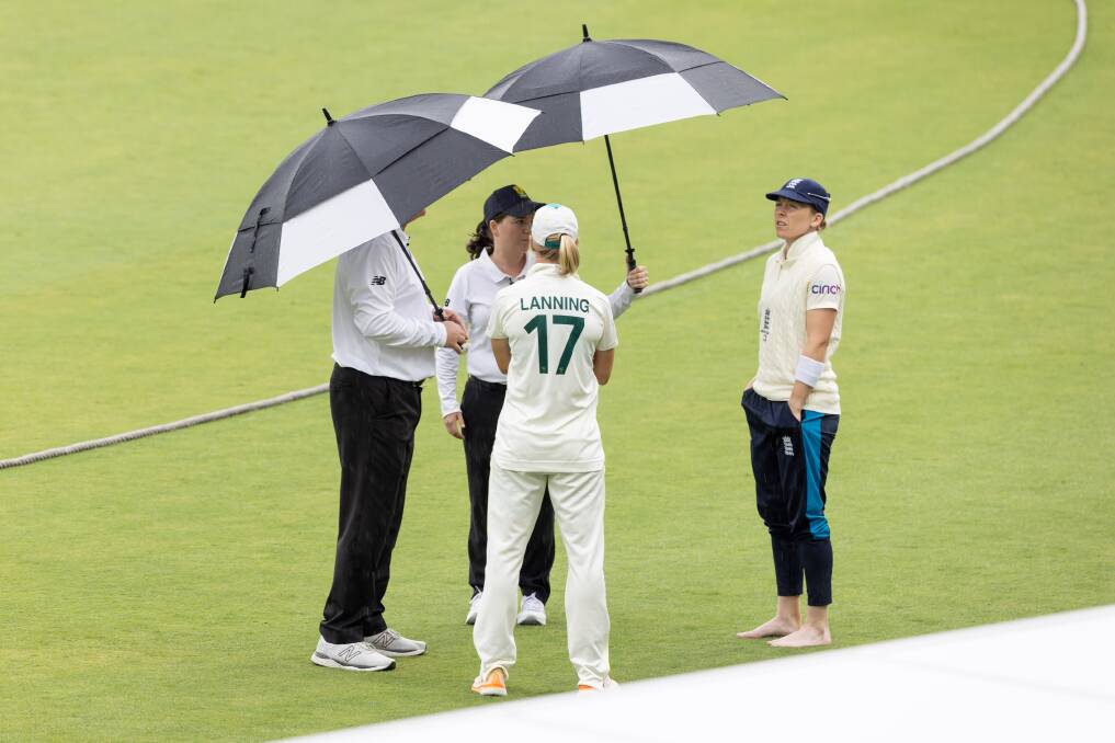 Australian captain Meg Lanning, and her English counterpart Heather Knight were left frustrated by Canberra's persistent rain on Saturday. Picture: Sitthixay Ditthavong