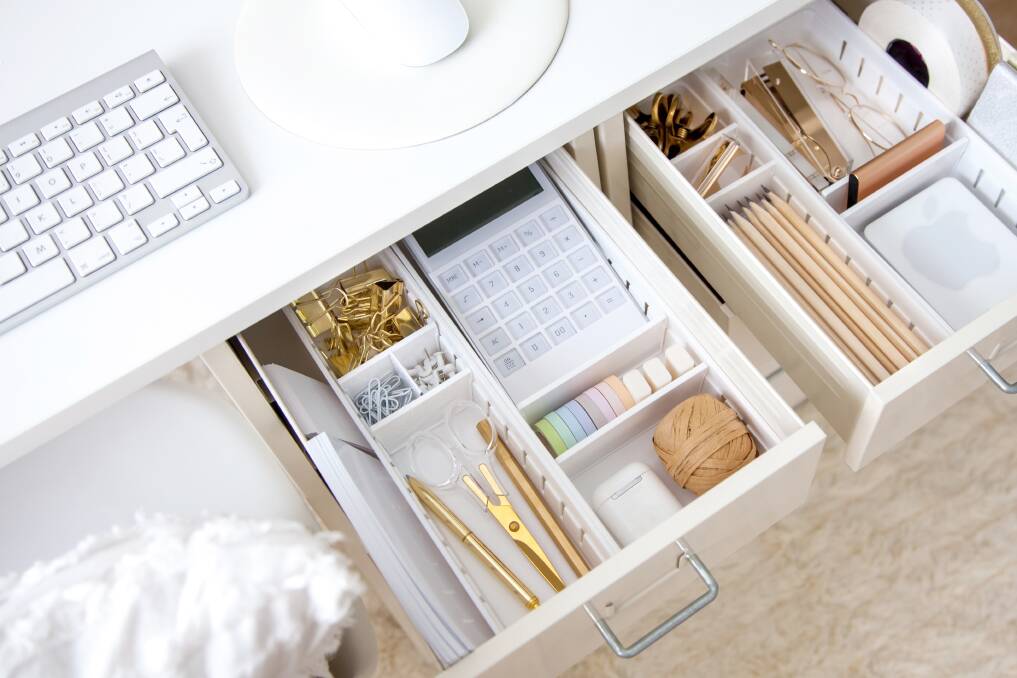 To prevent desk pile-ups, use inbox trays for incoming paperwork and filing systems. Picture Shutterstock