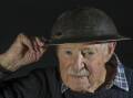 Then 93-year-old WWII veteran Joe Mullins with his bullet-pierced helmet in 2015. Picture by Graham Tidy.