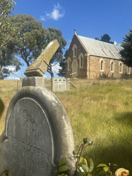 The precariously poised tip of a tombstone at the Hoskinstown Catholic Church graveyard. Picture by Tim the Yowie Man