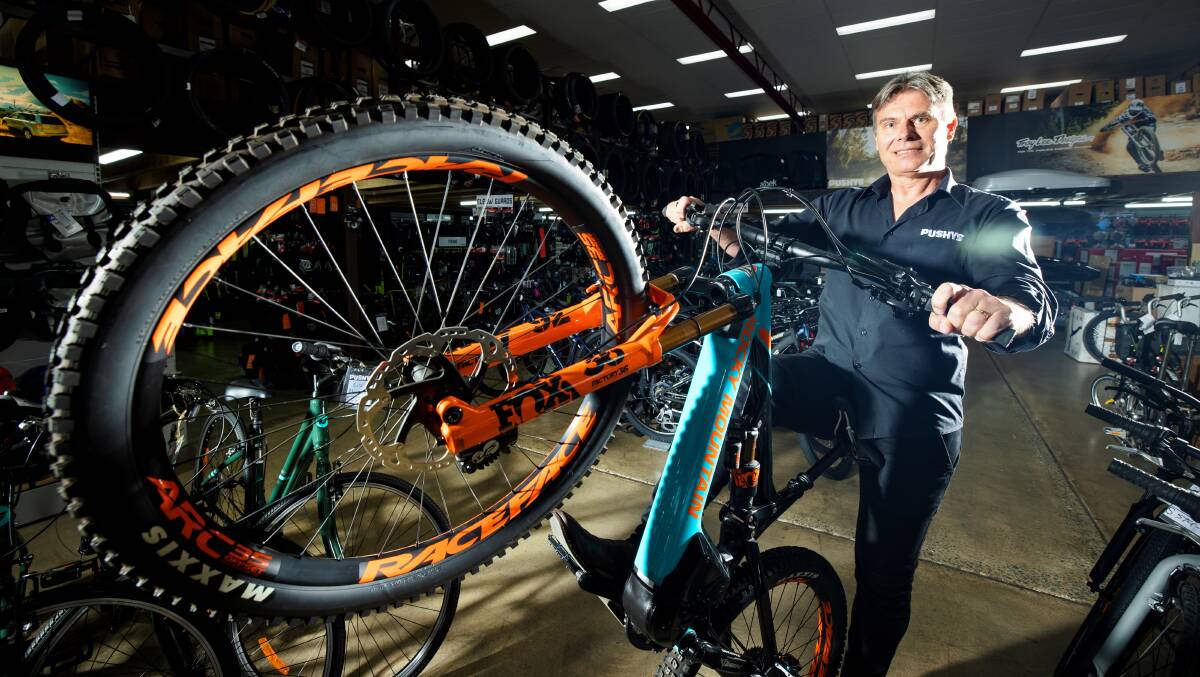 Pushys managing director Shane Wolki and a mountain e-bike, which proved a popular seller during Canberra's recent lockdown. Picture: Sitthixay Ditthavong
