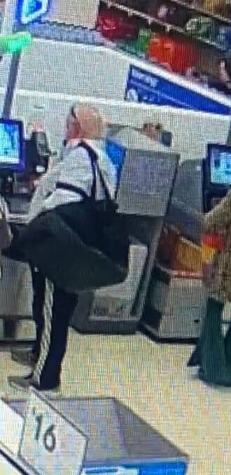 The suspected offender with the black duffle bag. Picture supplied