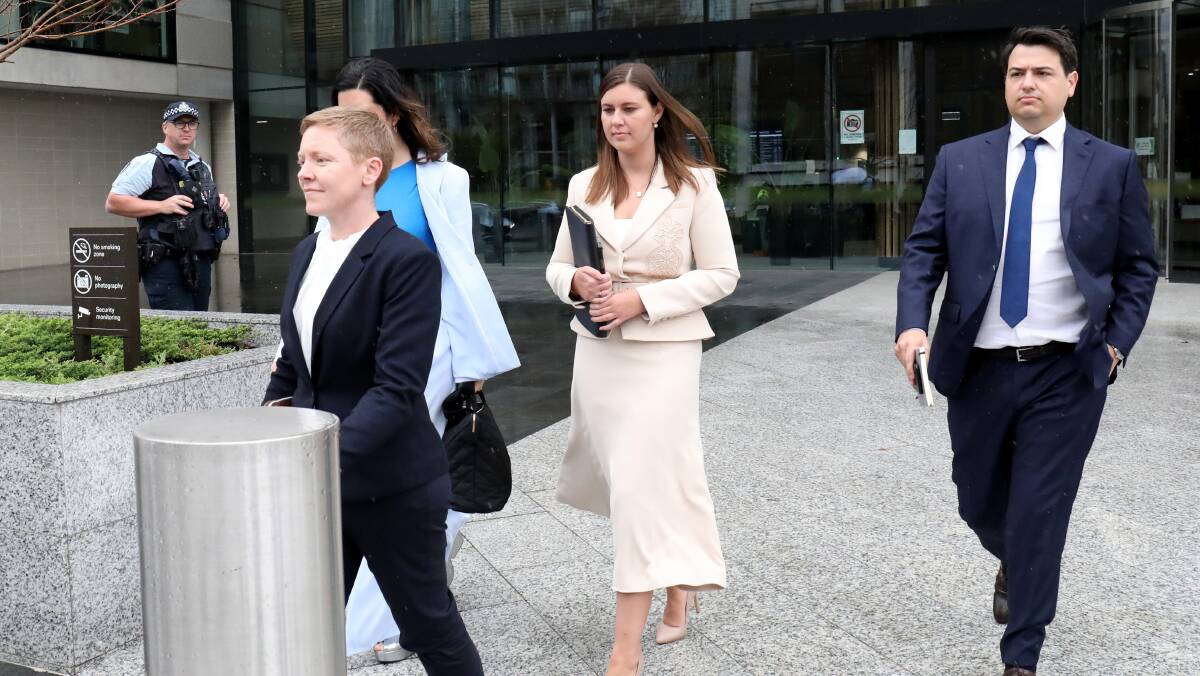 Brittany Higgins, centre, and her partner David Sharaz leaving court during the criminal trial in Canberra. Picture by James Croucher